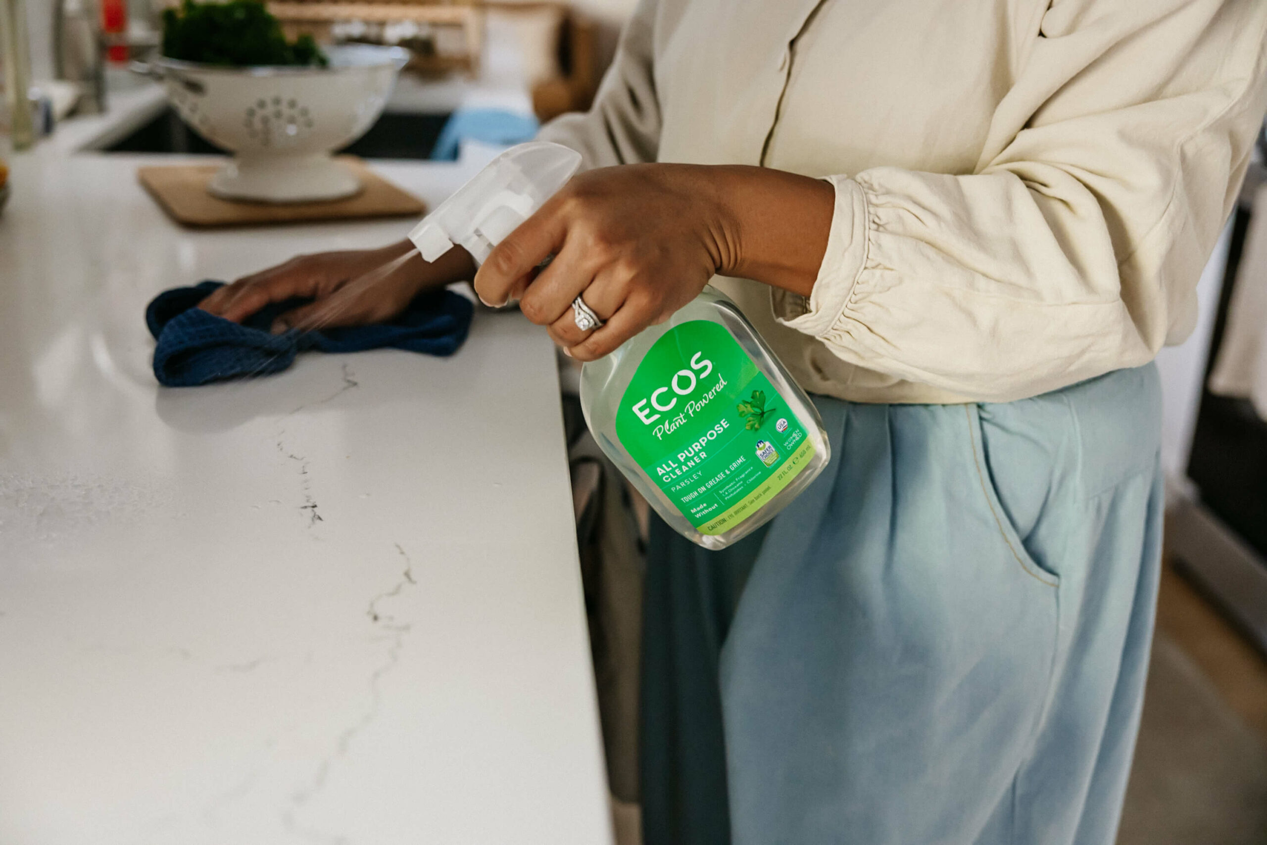 Woman spraying ECOS product
