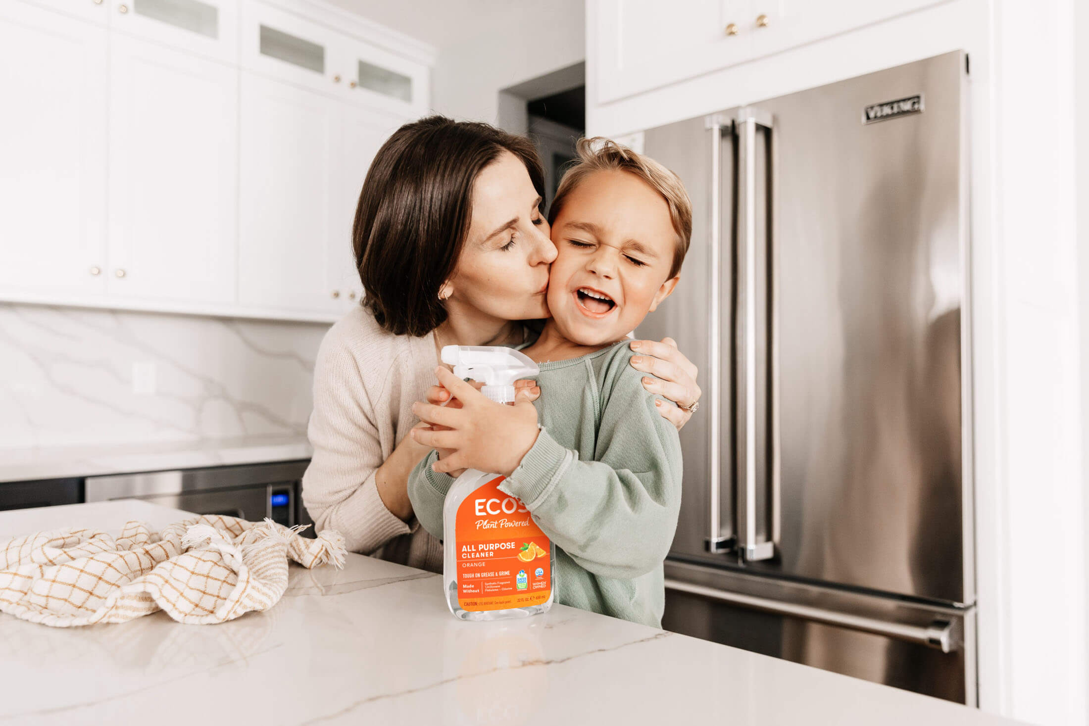 Woman and her child with ECOS cleaner