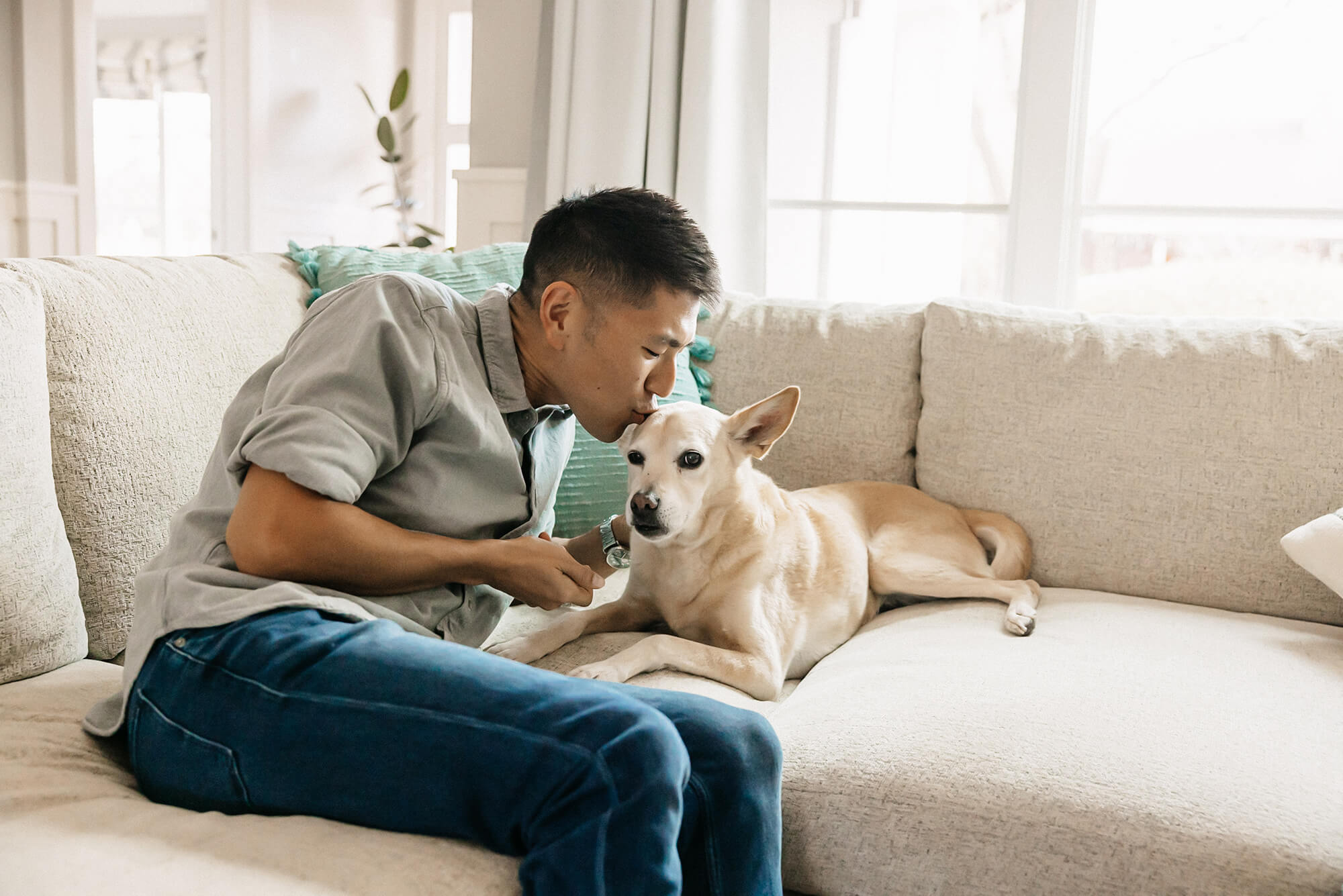 Man kissing his dog